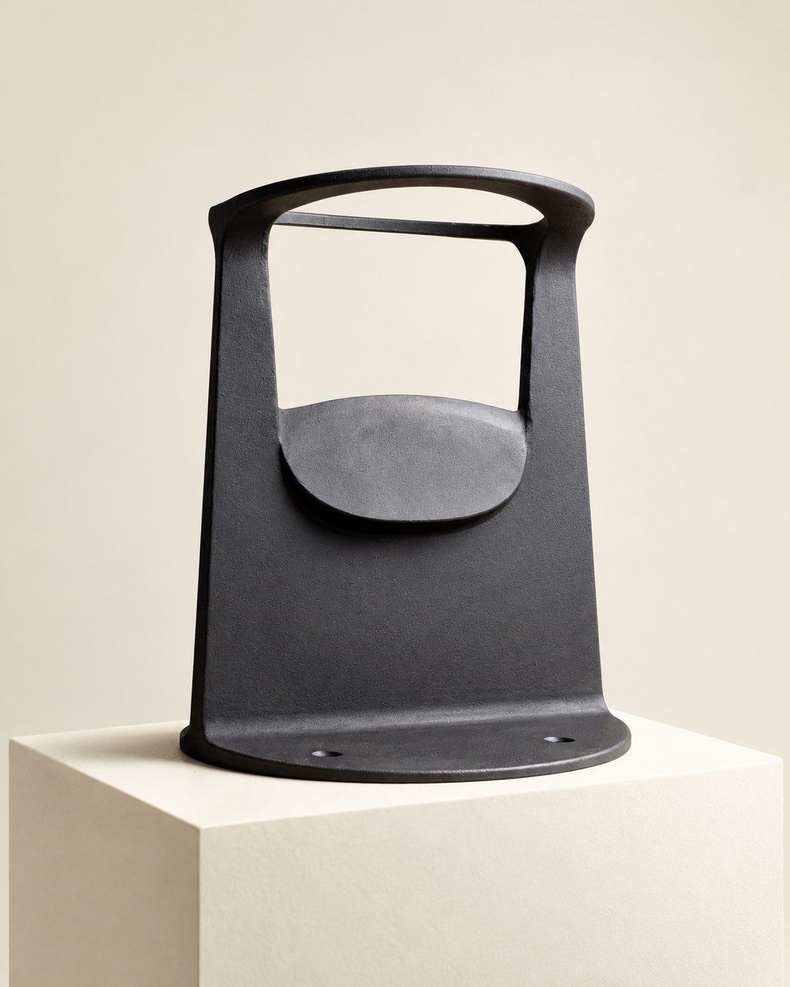 Low-angle front view of a black cast iron kindling splitter