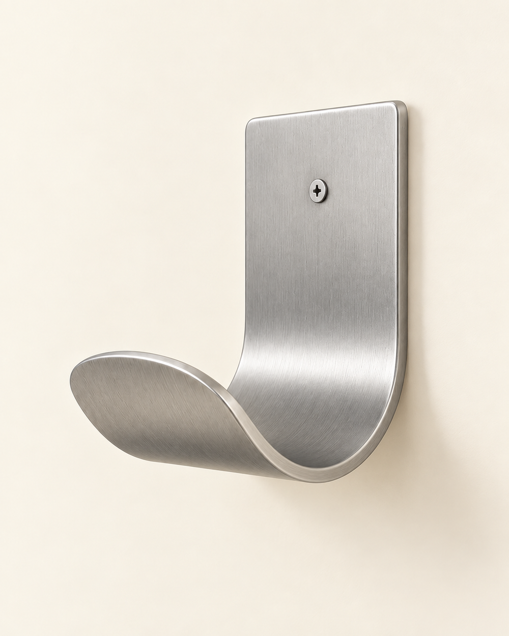 Brushed stainless steel garden hose holder mounted on a beige wall, three-quarter view